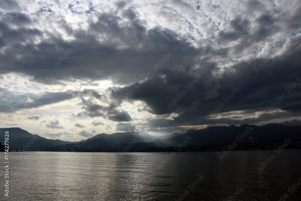 The sun behind cloud in Miyajima Island, Japan