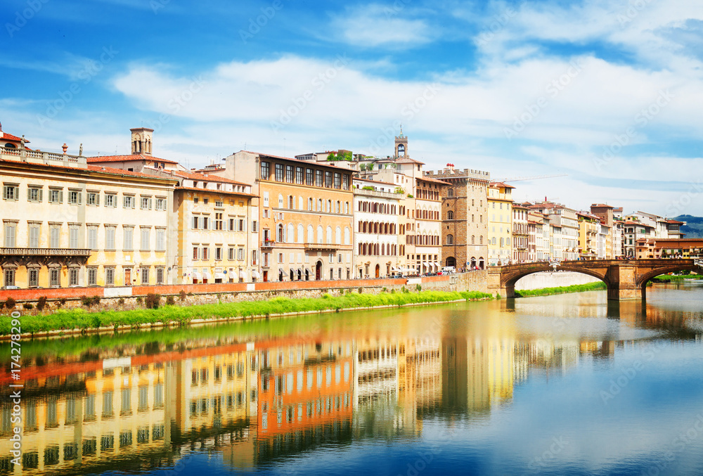 old town and river Arno reflecting in water at summer day, Florence, Italy, retro toned