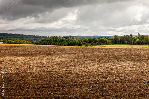 Arable land by the lake, Finland, tonning.Autumn view