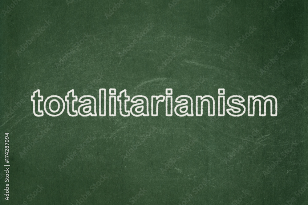 Politics concept: Totalitarianism on chalkboard background Politics concept: Totalitarianism on chalkboard background