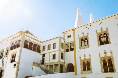 Manueline wing with two white famous chimneys of National Palace of Sintra or Town Palace, in Portuguese Palacio Nacional de Sintra. Medieval royal palace. Center of Sintra, Lisbon District, Portugal.