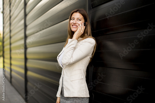 Businesswoman using mobile ...