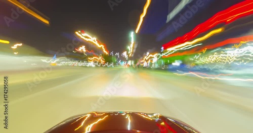 Vehicle Driving at Night in Downtown Dallas Time-lapse. a time-lapse view of the front of a vehicle traveling through downtown Dallas texas at night
