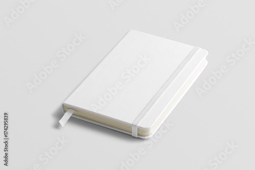 Blank photorealistic notebook mockup on light grey background, front view. photo