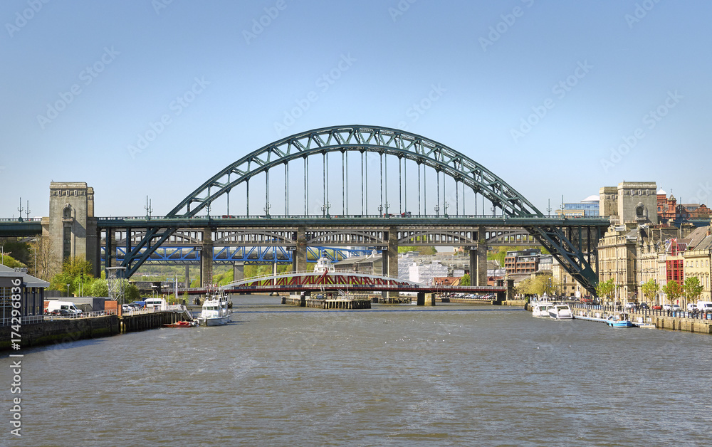 NEWCASTLE UPON TYNE, ENGLAND, UK - MAY 17, 2017: The iconic Tyne Bridge over the River Tyne at Newcastle & Gatesheads Quayside.