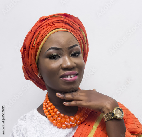 a young African lady in complete Yoruba attire photo