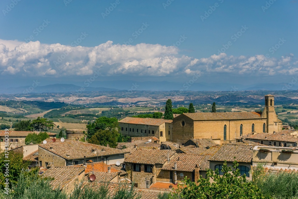 View on Tuscany landscape over the roofs of small town