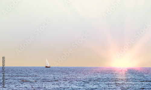 lonely yacht in the sea on the horizon