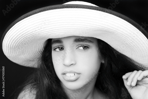 Portrait of a young african american girl with sun hat 