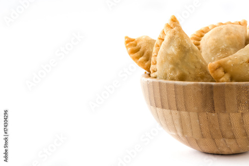 Typical Spanish empanadas in bowl isolated on white background