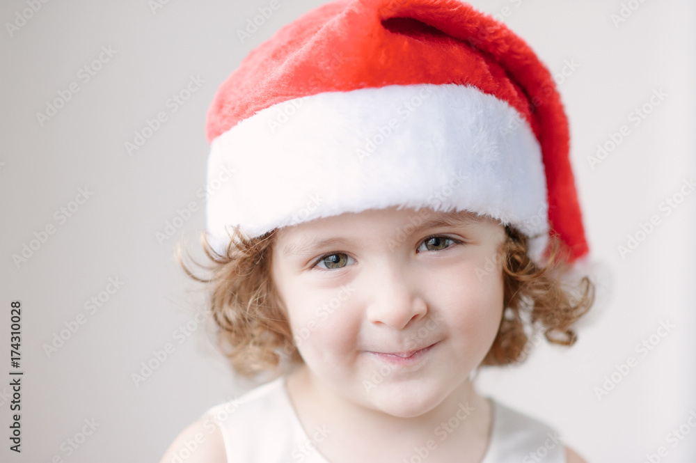 portrait of little cute girls in Santa hat portrait of little cute girls in Santa hat