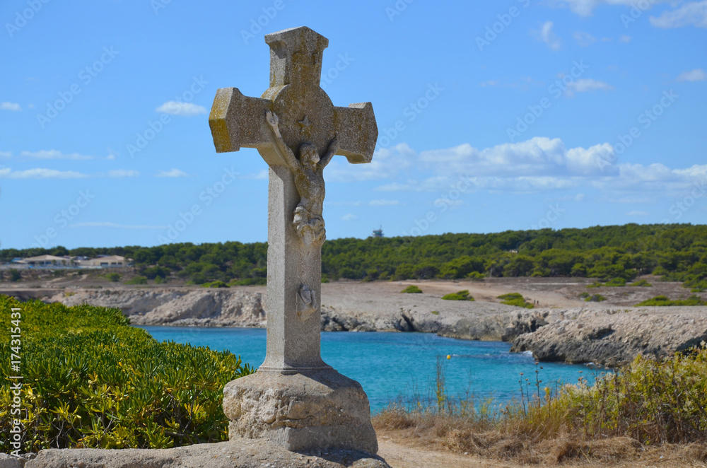 Cross of an old church in the Sainte Croix beach, south of France Cross of an old church in the Sainte Croix beach, south of France