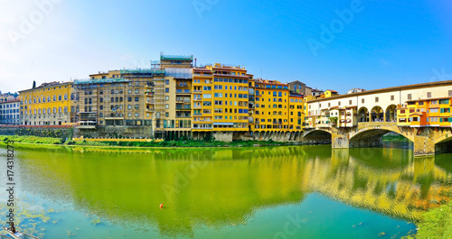 View of the Old Bridge across the Arno River in Florence on a sunny day © Javen