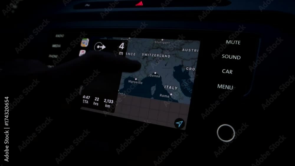 the guy uses the navigation in the car. the guy uses the navigation in the car.