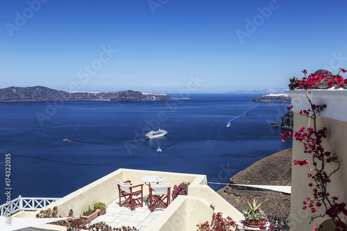 Greece, Santorini Island, terrace cafe on the background of the Aegean Sea