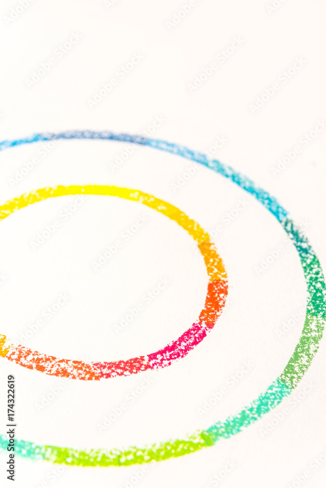 Cropped photo of two circles drawn with colorful pastel chalks Cropped photo of two circles drawn with colorful pastel chalks