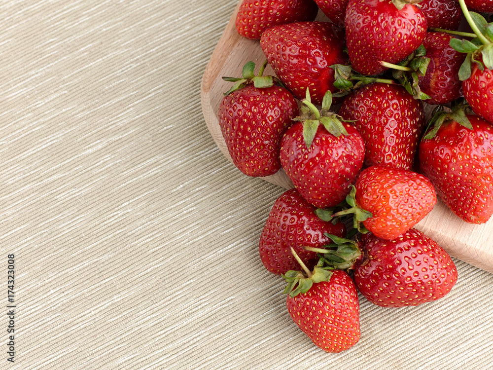 Beautiful ripe strawberry on a fabric background