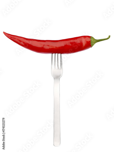 Red bitter pepper with a table fork © SKfoto