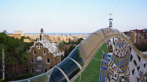 Gaudi mosaic bench and cityscape of Barcelona from park Guell, famous view of Barcelona, Spain, toned