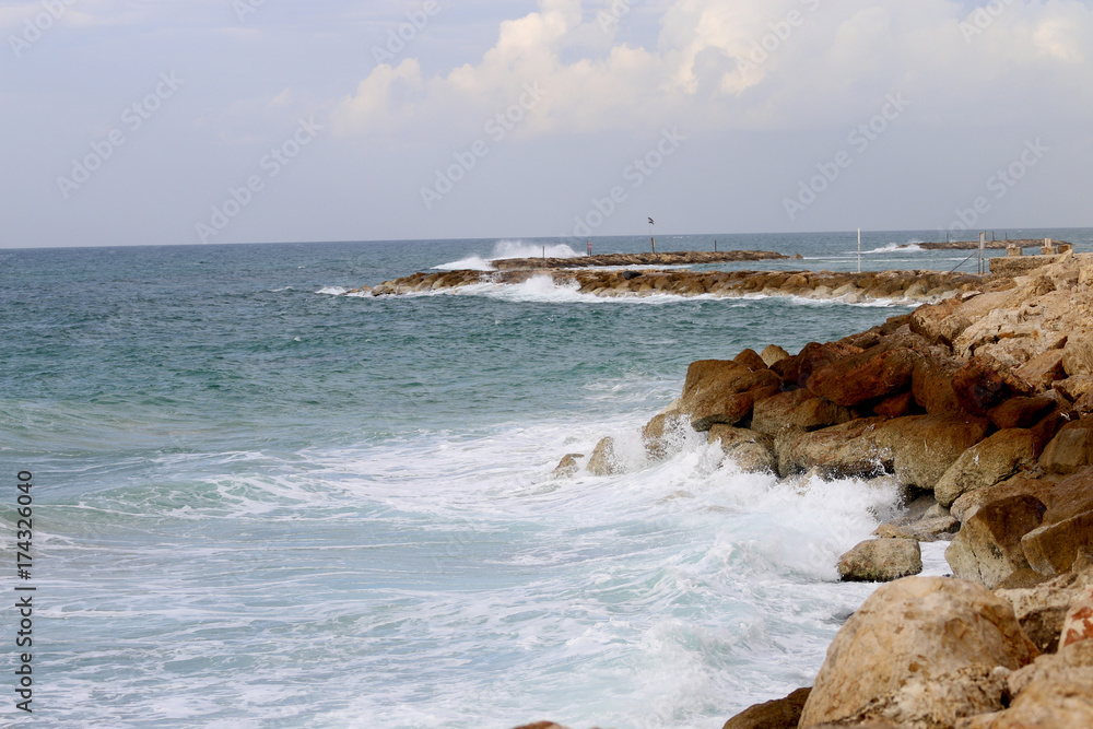 poerytyy beach stones stormy sea