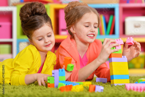 girls playing with colorful blocks