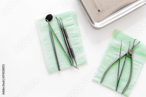 Dentists accessories. Tools on white background top view copyspace