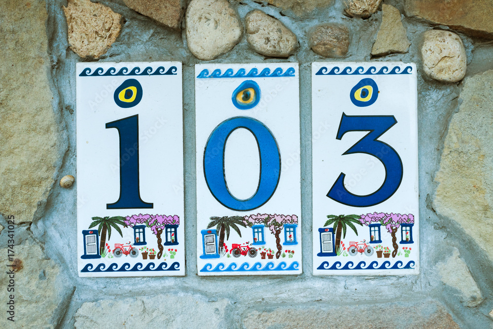 Fototapeta premium house number from ceramic tiles on the wall