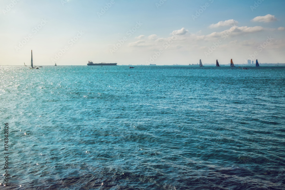 Sunny seascape with boats and yahts regatta on the horizon Sunny seascape with boats and yahts regatta on the horizon
