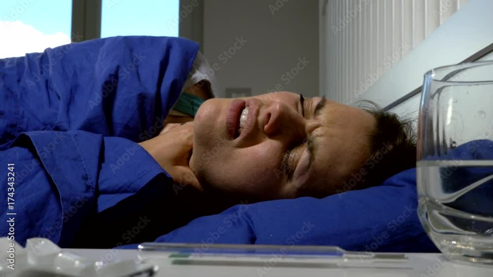 Woman in bed feeling sneezing strong feeling sick medium shot 4K Woman in bed feeling sneezing strong feeling sick medium shot 4K