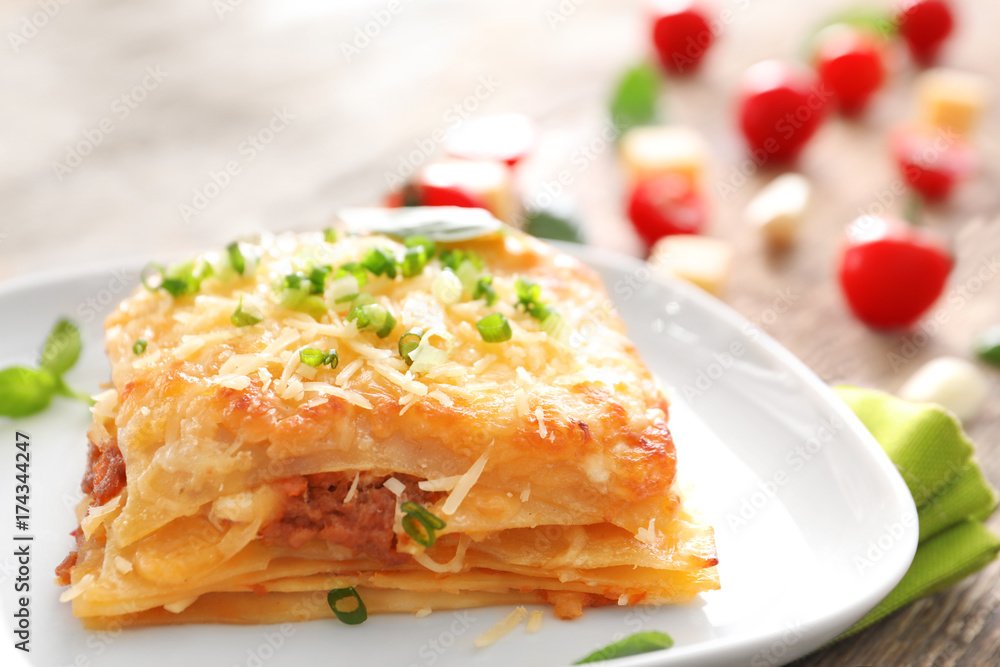 Plate with tasty lasagna on table Plate with tasty lasagna on table