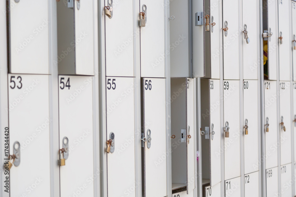 Obraz premium White boxes with numbers at the beach with selective focus.