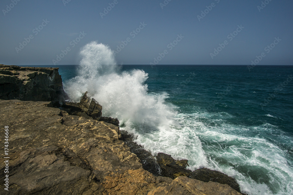 Rock in the surf with very high waves Rock in the surf with very high waves