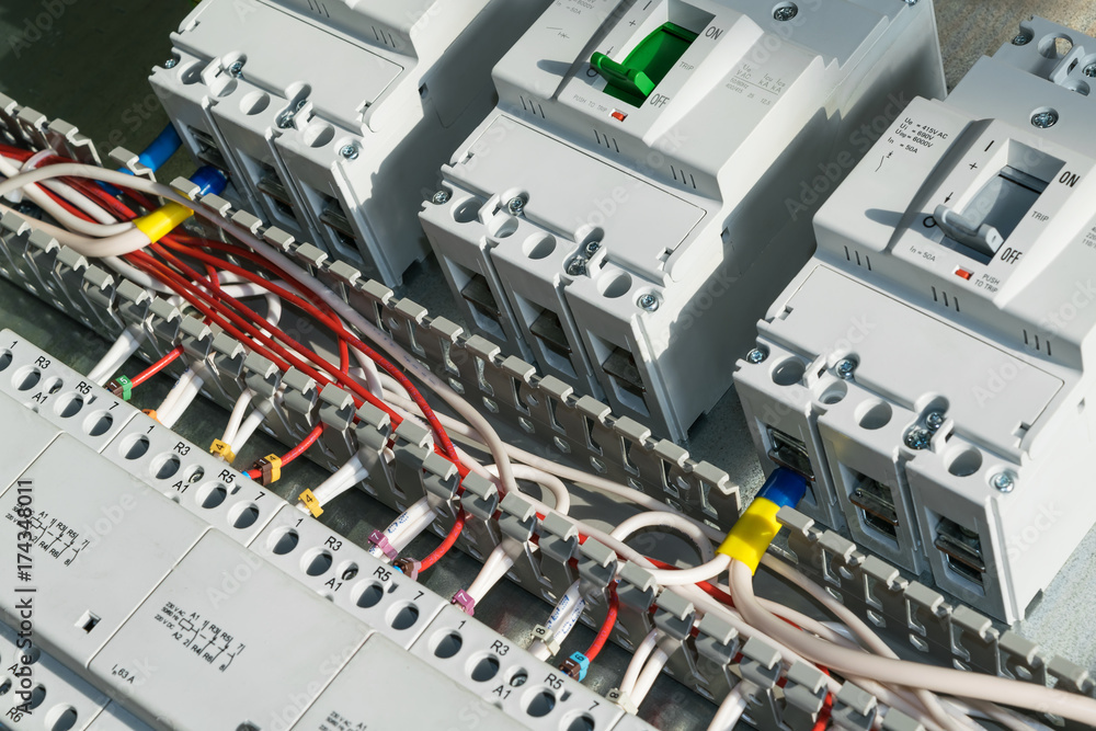 A series of modular magnetic contactors and a range of power circuit breakers. Between the rows of contactors and switches, perforated cable channels. To the contactor of the connected wires. A series of modular magnetic contactors and a range of power circuit breakers. Between the rows of contactors and switches, perforated cable channels. To the contactor of the connected wires.