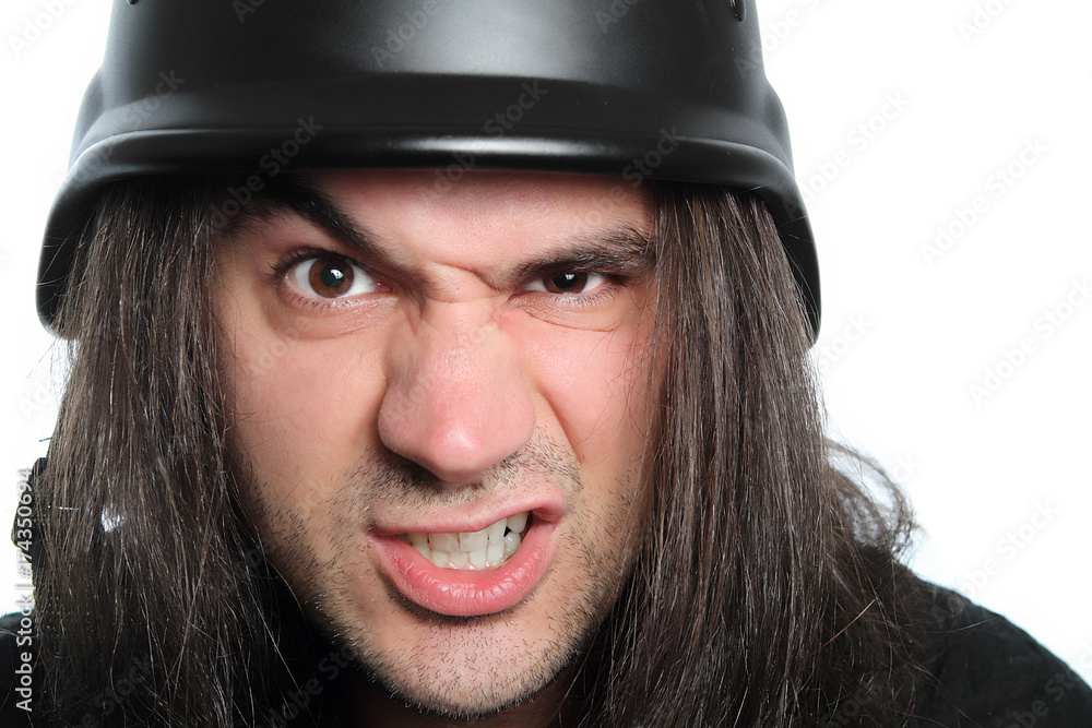 angry man with long hair and police helmet angry man with long hair and police helmet