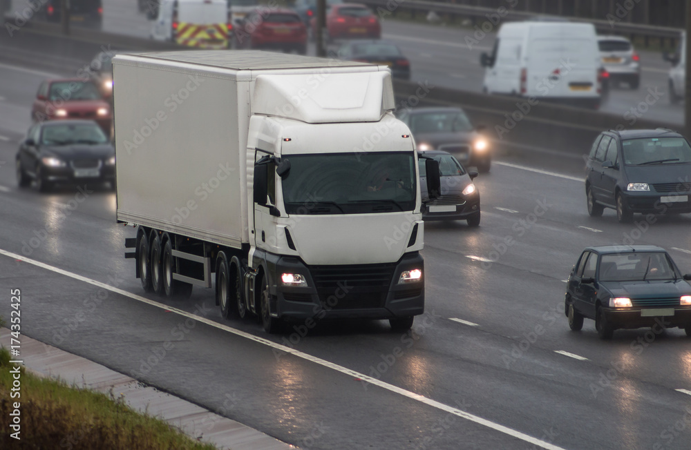 Lorry in motion in a rainy weather