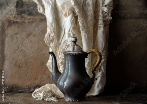 Antique Coffee Pot in Rustic setting photo