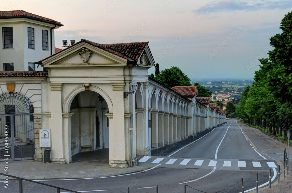 Street view of Northern Italian arches in the evening at dusk