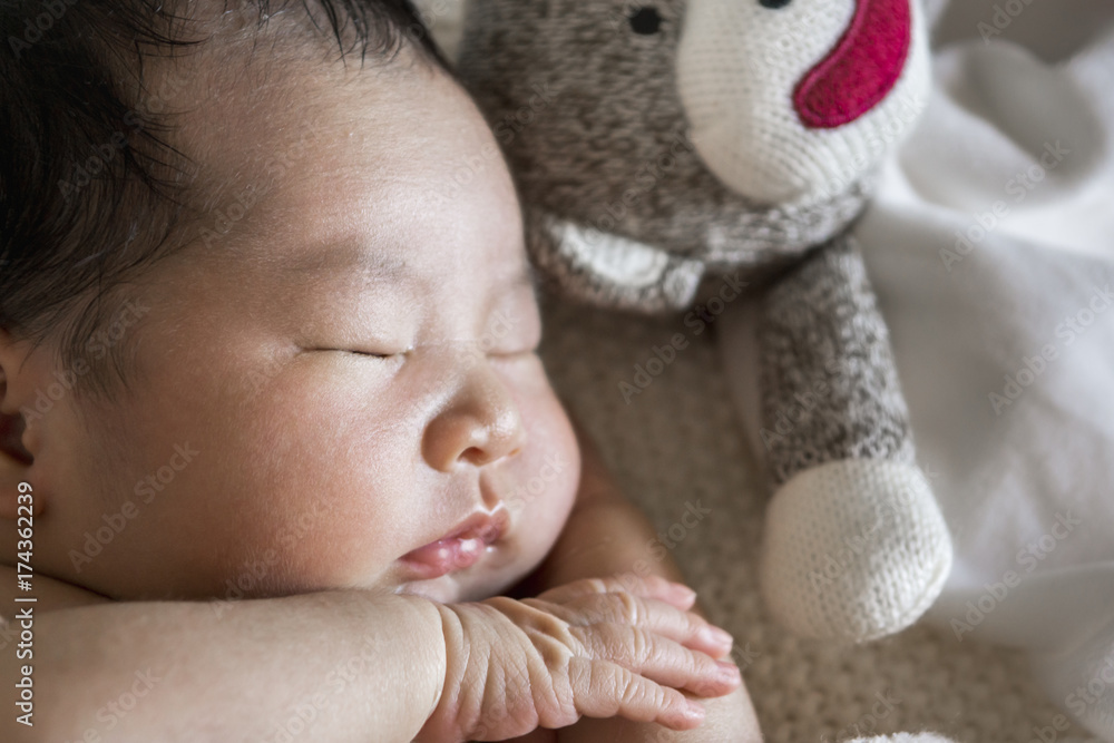 Close up of an Asian newborn baby, sleeping Close up of an Asian newborn baby, sleeping