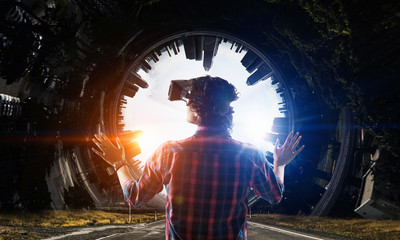 Man in virtual helmet . Mixed media