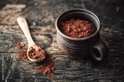 Food: raw cocoa powder in a cup photo