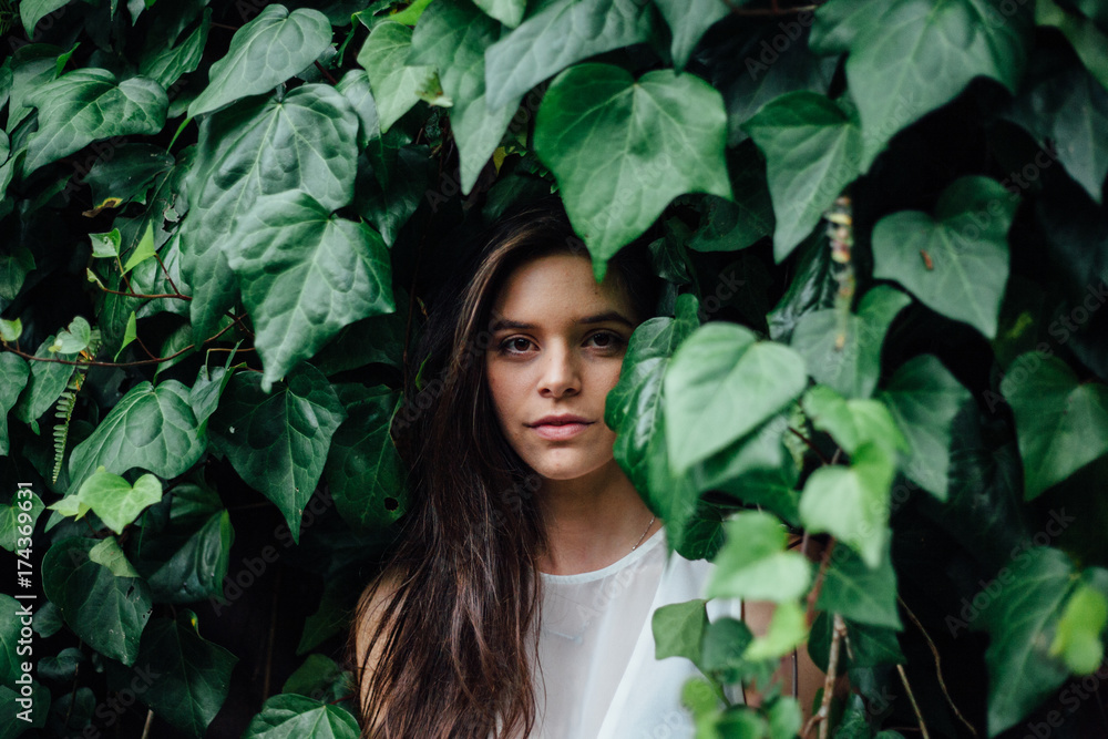 Woman in front of foliage Woman in front of foliage