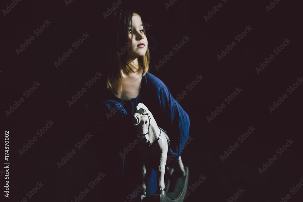 Child holding toy hourse Child holding toy hourse