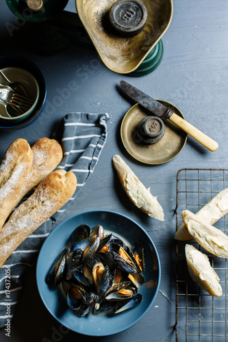 Moules mariniere served with crusty french bread. photo