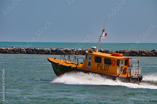 Miami based pilot boat heading out to open ocean to guide a cargo ship through Government Cut to the Port of Miami.