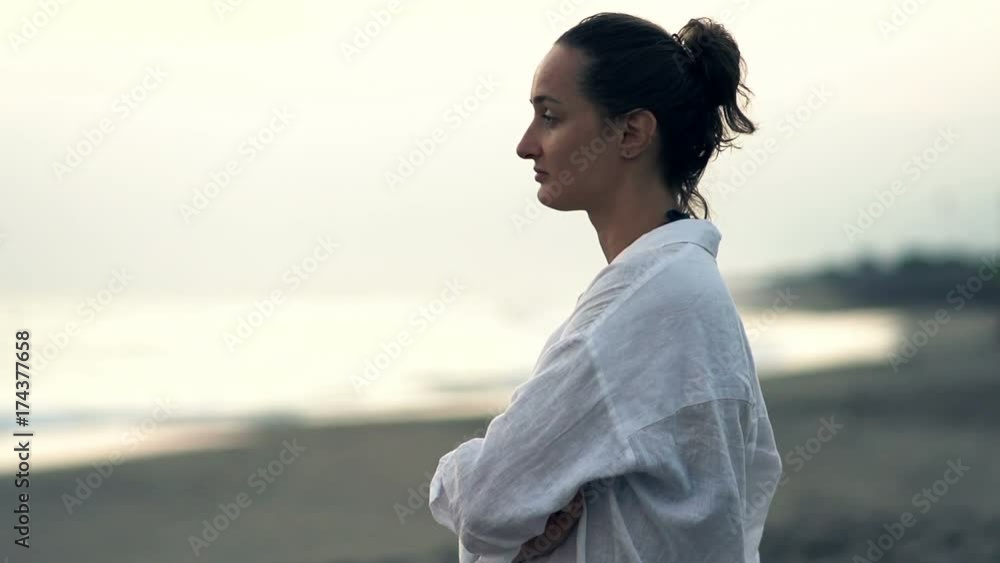 Pensive, sad woman in shirt standing on beach, super slow motion 240fps
Pensive, sad woman in shirt standing on beach, super slow motion 240fps