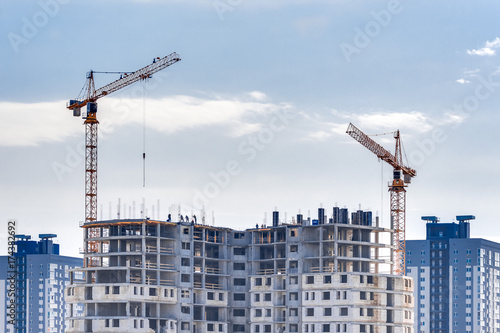 buildings under construction with cranes