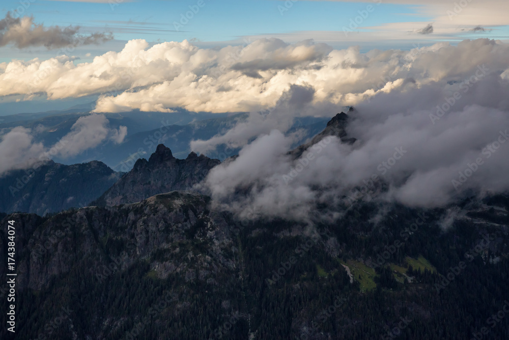 Beautiful aerial landscape view of SkyPilot Mountain covered in clouds. Picture taken near Squamish, British Columbia, Canada. Beautiful aerial landscape view of SkyPilot Mountain covered in clouds. Picture taken near Squamish, British Columbia, Canada.