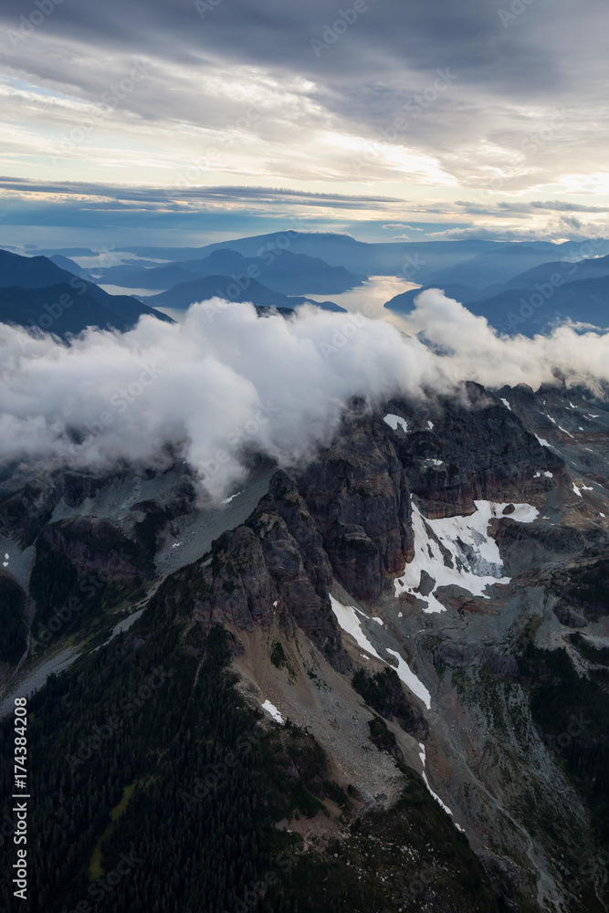 Aerial landscape view of SkyPilot Mountain covered in clouds. Picture taken near Squamish, BC, Canada.