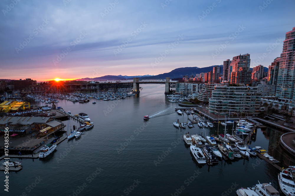 False Creek in Downtown Vancouver, British Columbia, Canada. Taken from an aerial perspective during a colorful sunset.
