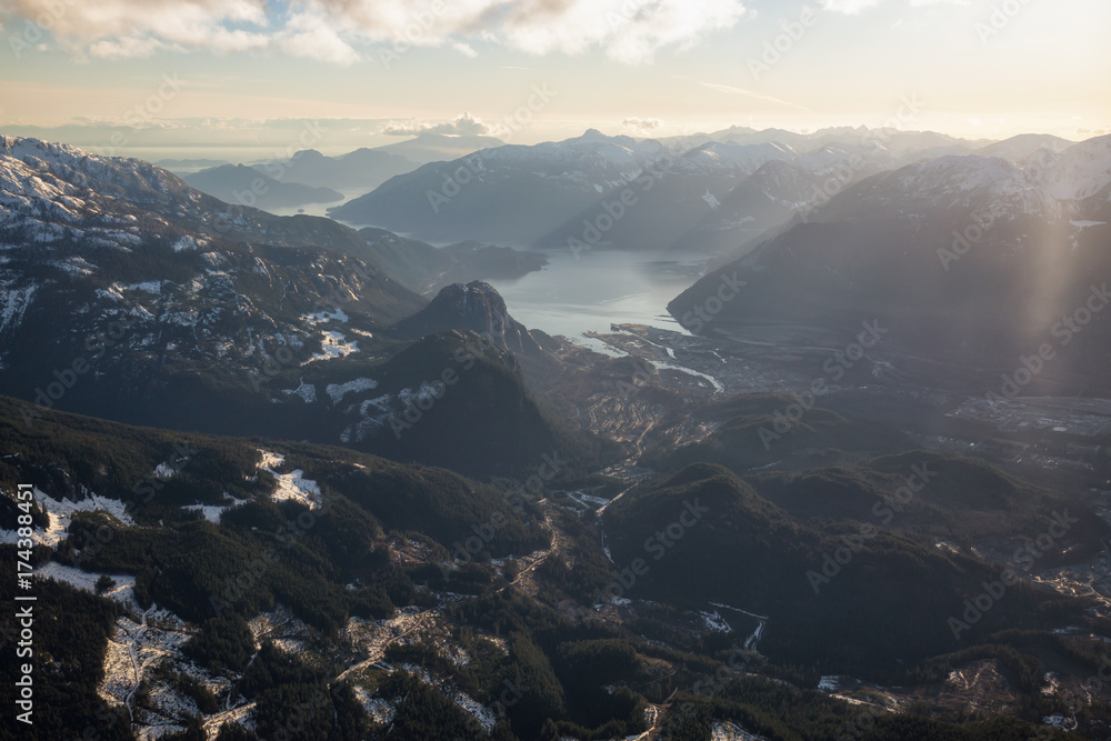 Aerial view of Squamish City, BC, Canada, during a winter sunset.